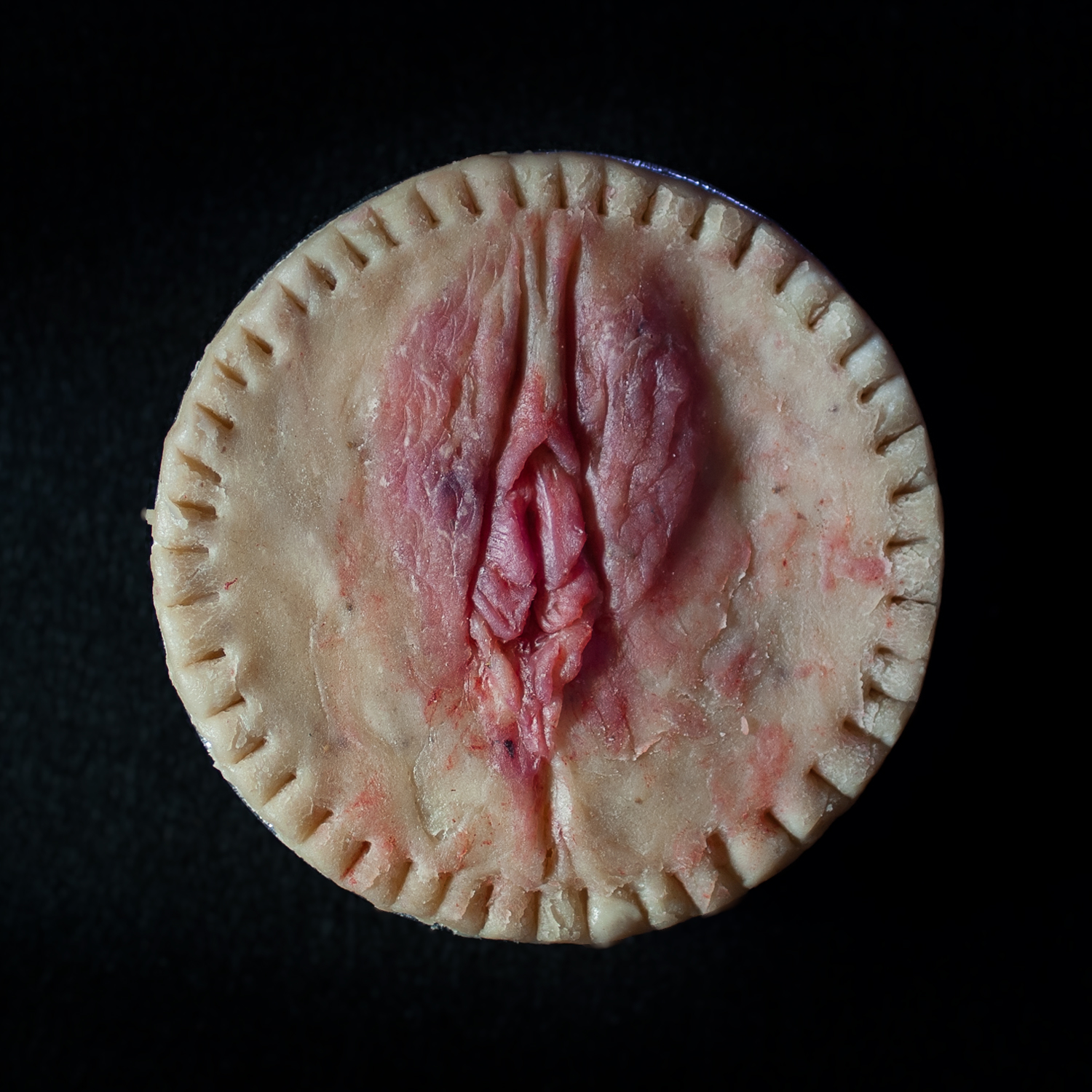 4 inch peach vulva pie with a realistic pie crust design, coloring made with freeze-dried strawberries
