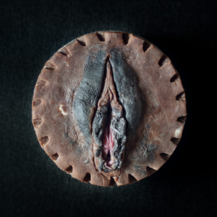 Peach pie with a vulva pie crust design, vulva colored with natural food colorings