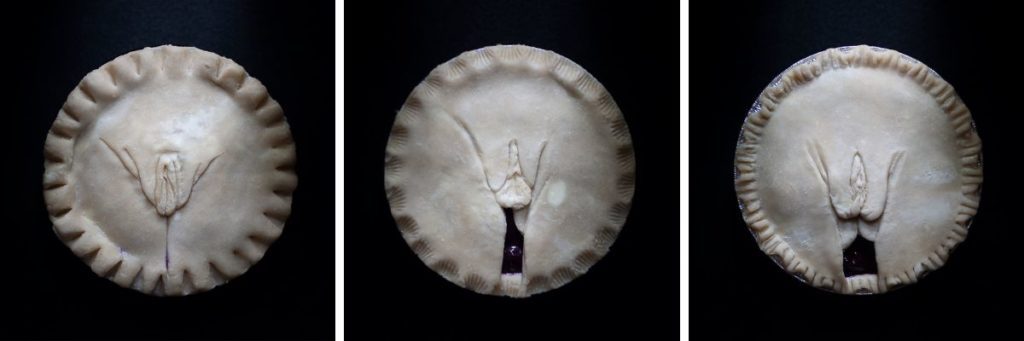 Full frontal vulva pie art showing 3 pies hand sculpted to look like human vulvas.