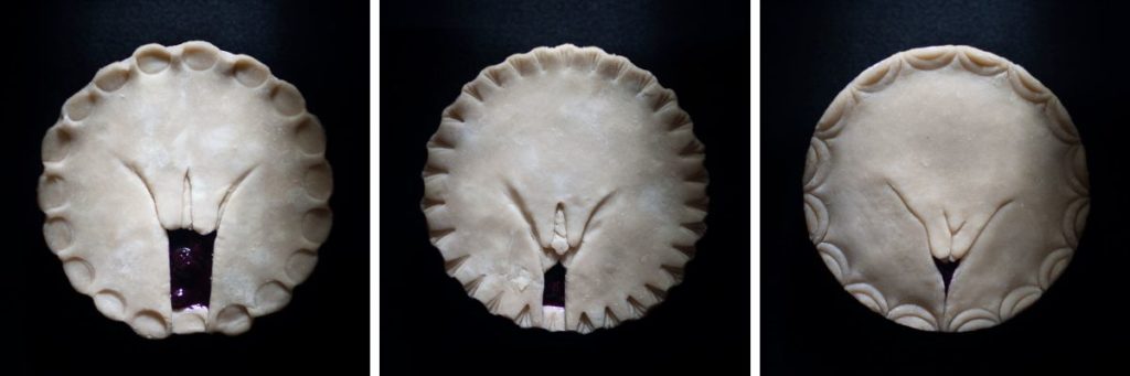 Full frontal vulva pie art showing 3 pies hand sculpted to look like human vulvas from series 2, pies in the window