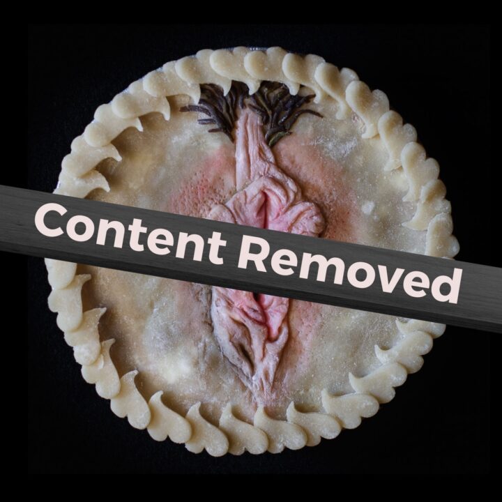 Pie 75 with a banner across it that says Content Removed. This was a vulva pie on a black background that was removed by Meta.
