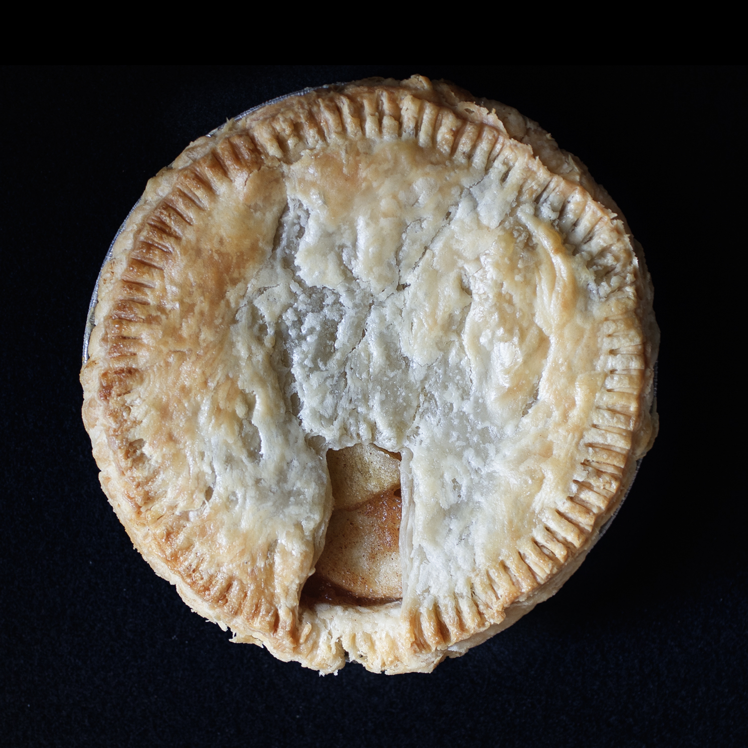 Baked pie with hand sculpted vulva art made for Pies in the Window